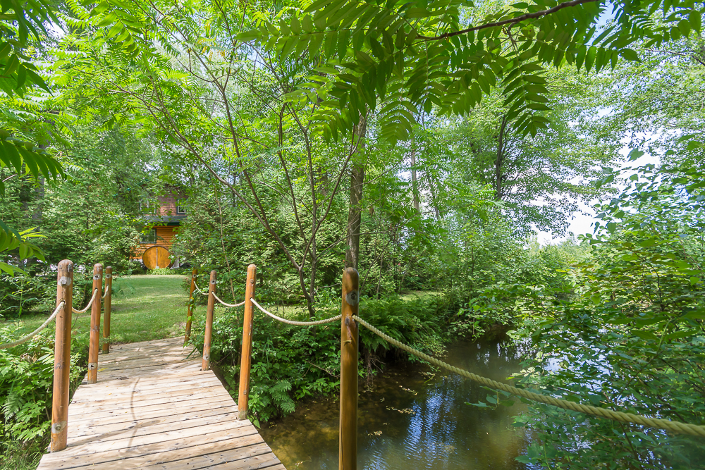 Ponderosa Ranch Resort, Log Cottage and Cabin in Canada Ontario, Summer Season, foot bridge to log house